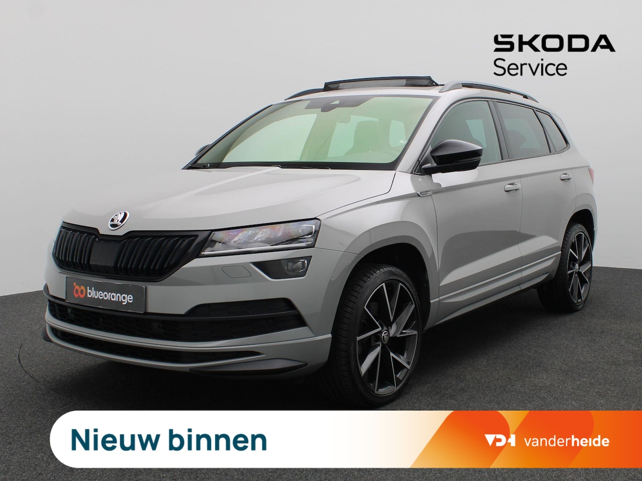 Skoda Karoq - 1.5 TSI ACT Sportline Business 150PK DSG Pano-Schuifdak, Trekhaak, Canton Audio, Side Assi - AutoWereld.nl