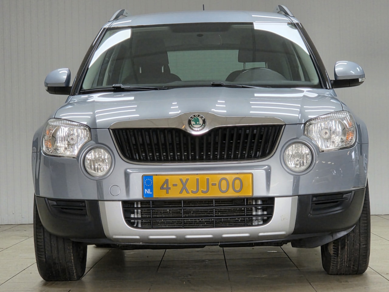 Skoda Yeti - 1.2 TSI Comfort/ Trekhaak/ Automaat/ 16'' LMV/ Extra getint glas/ PDC/ Airco/ LEDER. Stuur - AutoWereld.nl