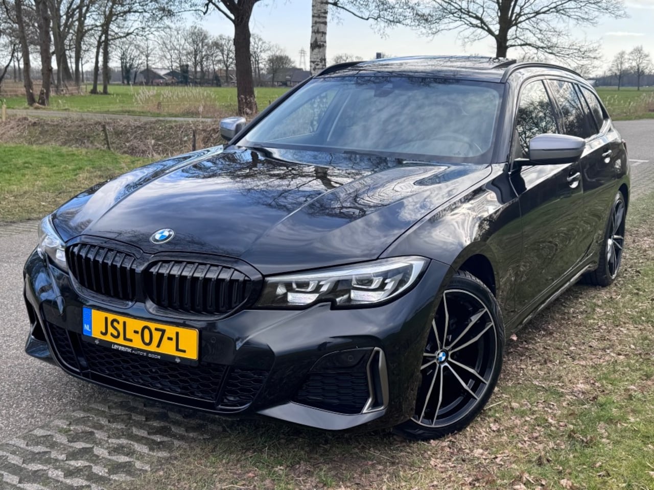 BMW 3-serie - 318I MSPORT / PANO / 19INCH / 24DKM - AutoWereld.nl