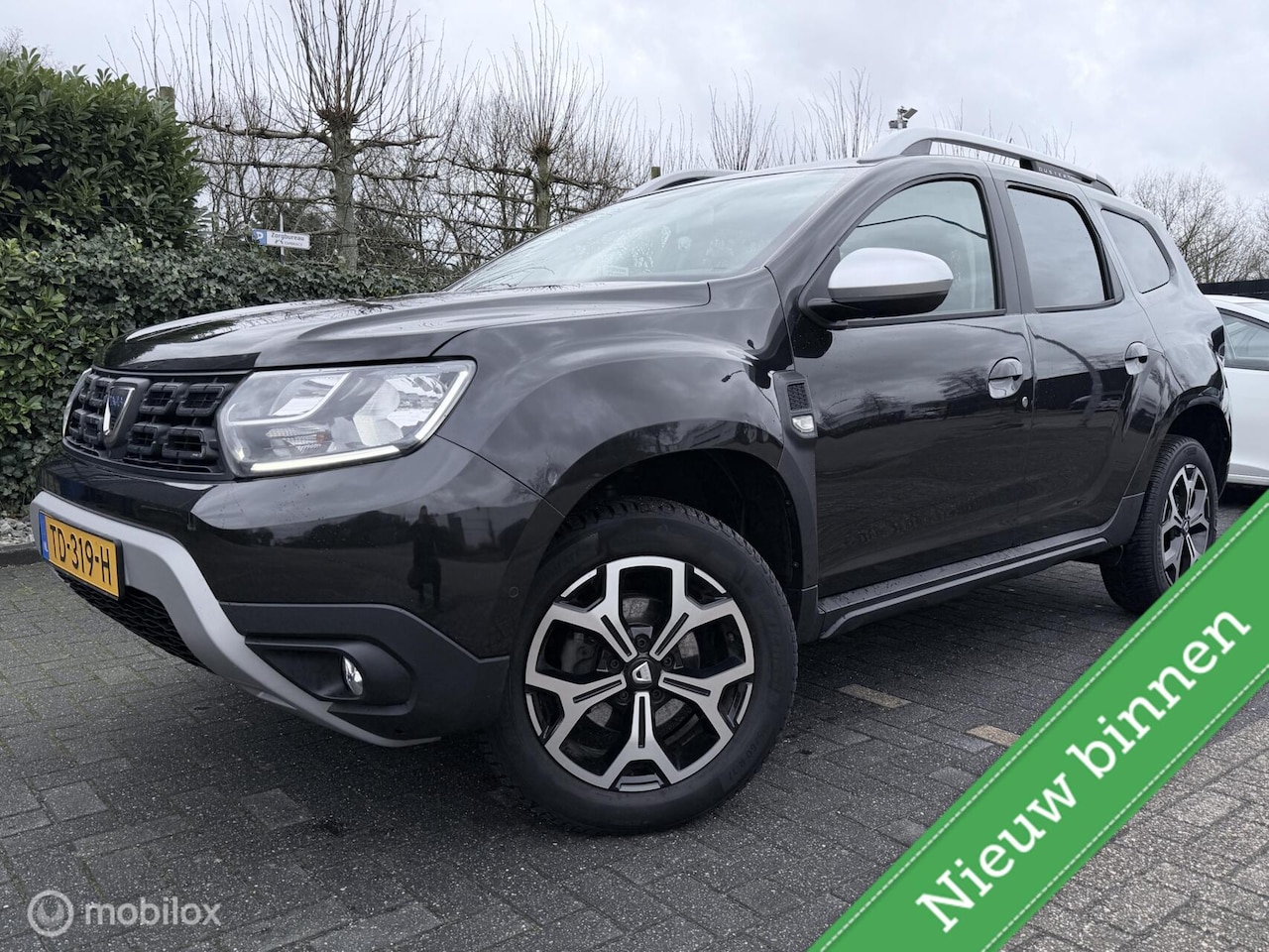 Dacia Duster - 1.2 TCe Prestige LEER / NAVI / CLIMA / CRUISE / LED / TREKHAAK / 360 CAMERA - AutoWereld.nl