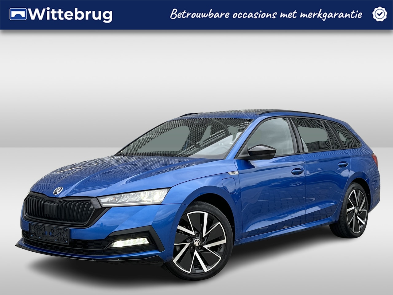 Skoda Octavia Combi - 1.4 TSI iV PHEV 204PK Sportline Business / Zwenkbare Trekhaak / Panoramadak / Standkachel - AutoWereld.nl