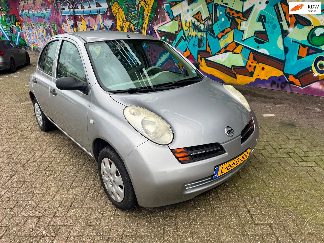 Nissan Micra - 1.0 basis met 136.000 km airco 5 deuren elektrisch ramen centrale vergrendeling stereo boe - AutoWereld.nl