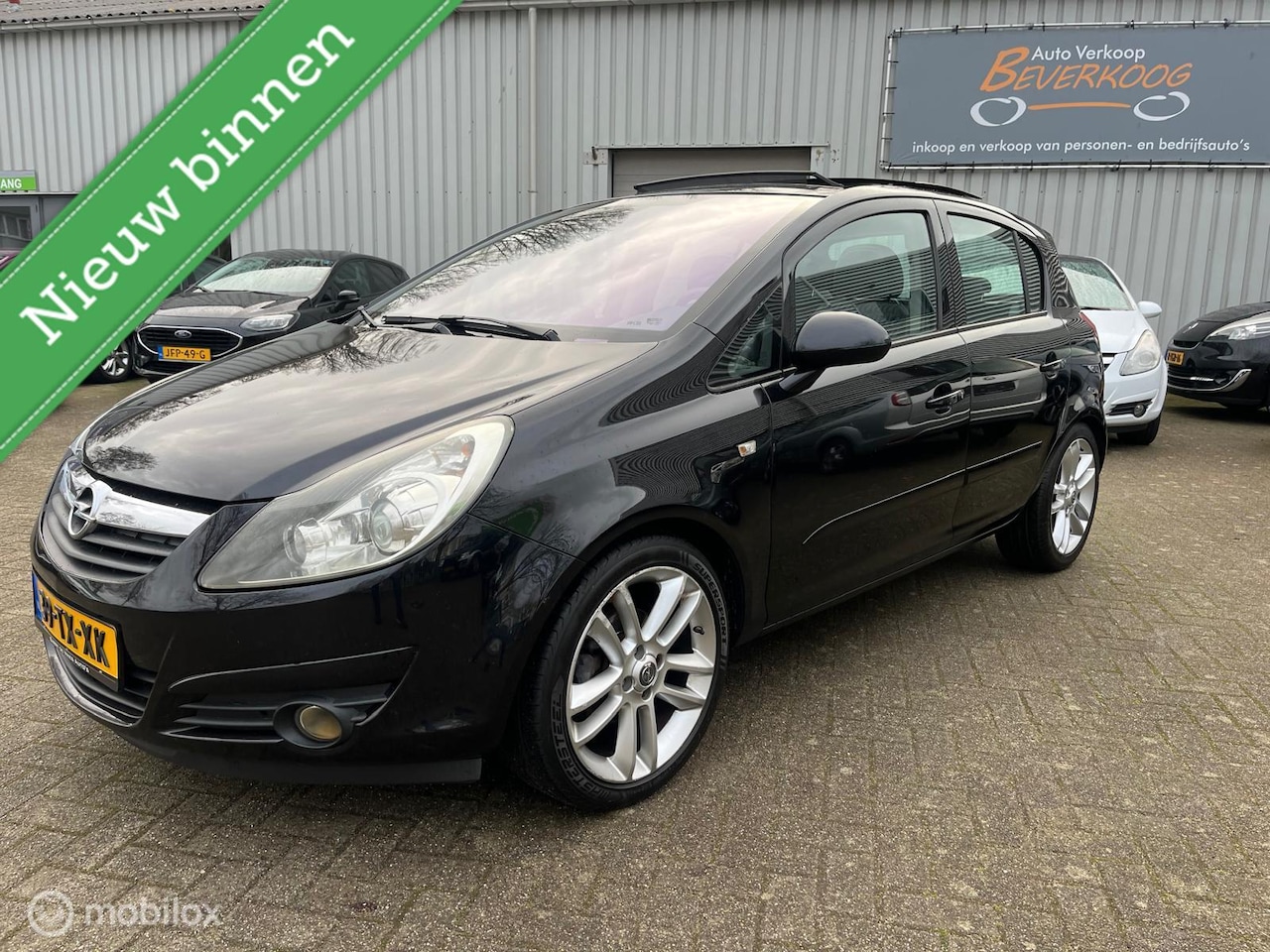 Opel Corsa - 1.2-16V Cosmo / PANORAMADAK - AutoWereld.nl