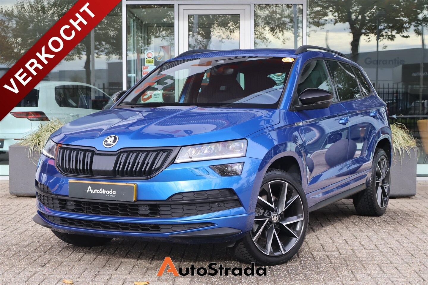 Skoda Karoq - 1.5 SportLine TSI 150pk | Canton Audio | Sfeer | Stoelverwarming | ACC | Carplay | Navi | - AutoWereld.nl