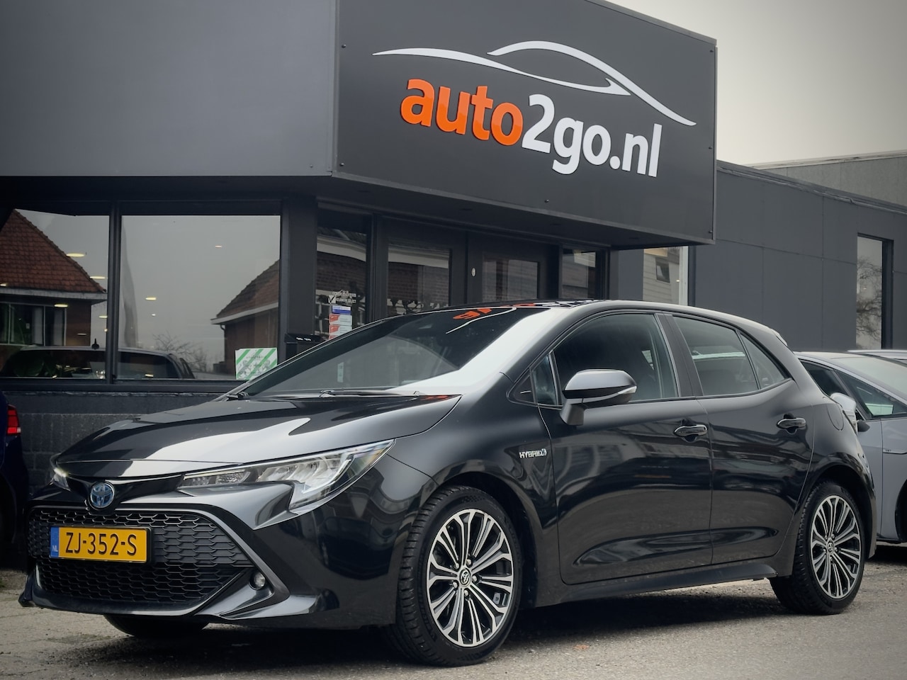 Toyota Corolla - 1.8 HYBRID AUT FIRST EDITION 97D.KM! NAVI CAMERA LED LMV PDC - AutoWereld.nl