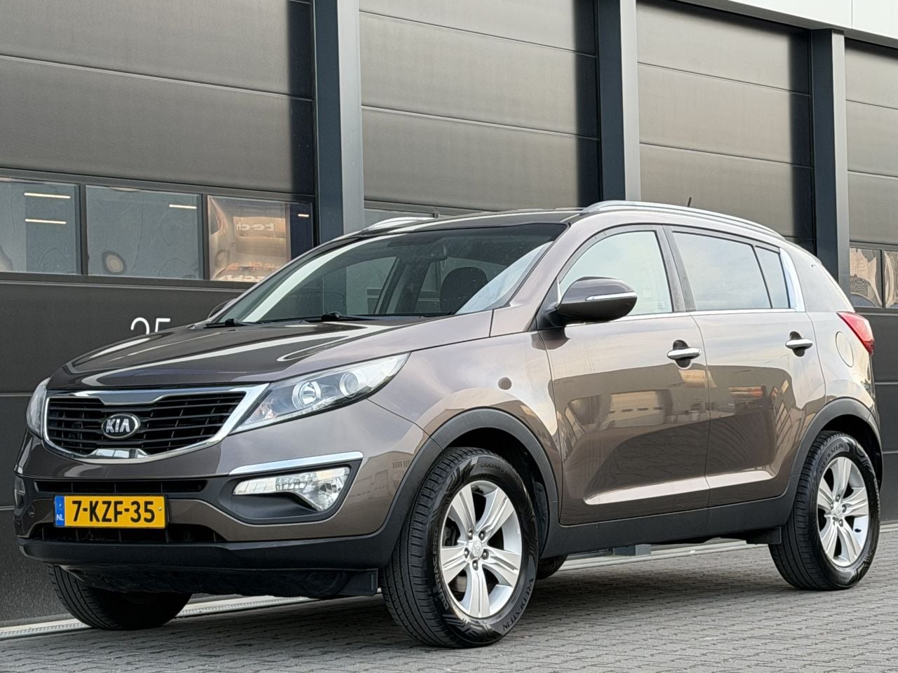 Kia Sportage - 1.6 GDI Navi Leer Clima PDC - AutoWereld.nl