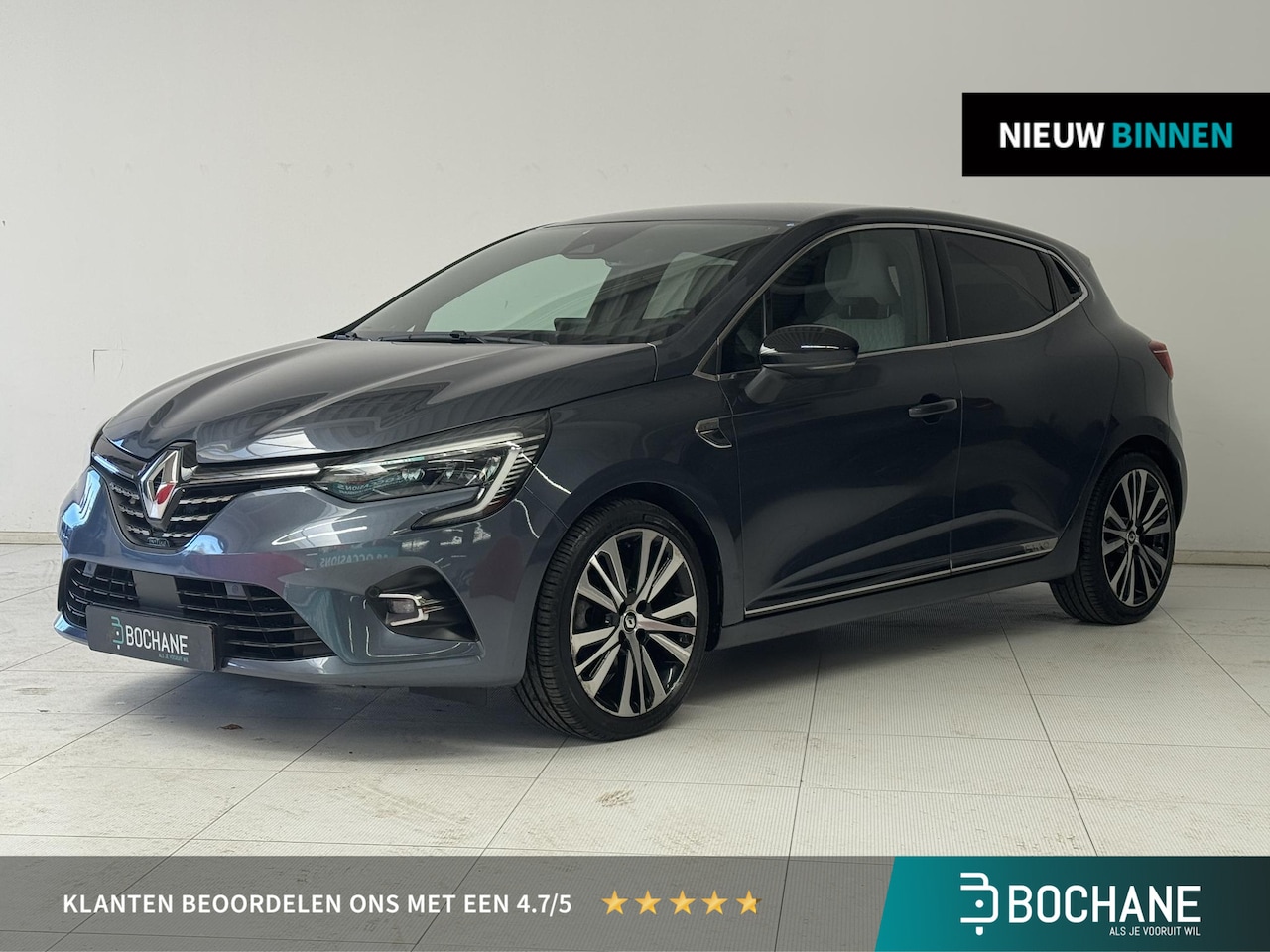 Renault Clio - 1.6 E-Tech Hybrid 140 Initiale Paris | Leder | Stoelverwarming | Navigatie | Achteruitrijc - AutoWereld.nl