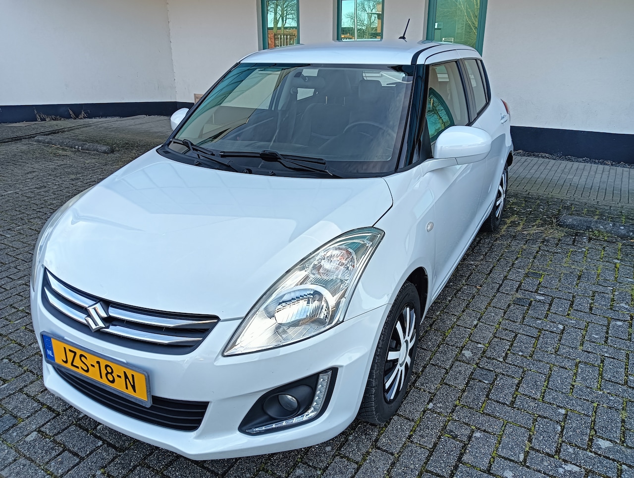 Suzuki Swift - Style. Airco. Cruise control . Kilometerstand 79700. - AutoWereld.nl