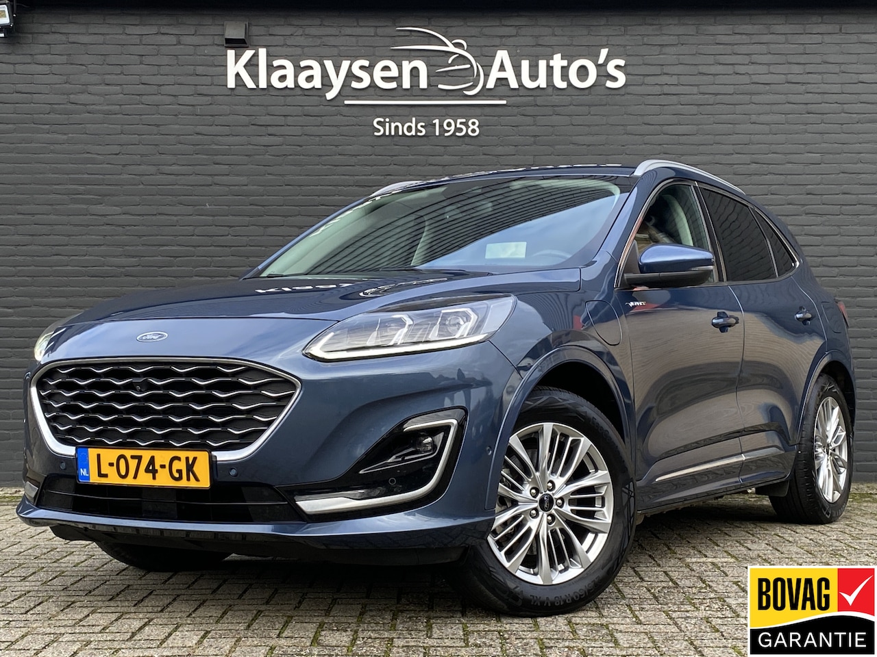 Ford Kuga - 2.5 PHEV Vignale 225 pk AUT. | 1e eigenaar | navigatie | leder interieur | winterpakket | - AutoWereld.nl