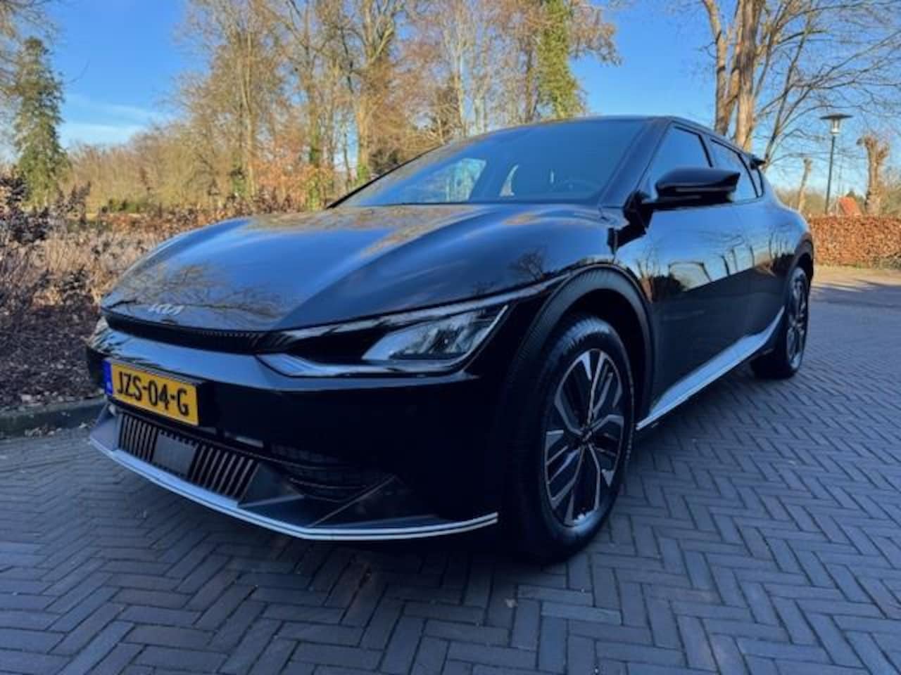 Kia EV6 - AIR 77.4KWH SOH 100% HLEER/NAV/ACRUISE/ACARPLAY/FABRIEKSGARANTIE - AutoWereld.nl