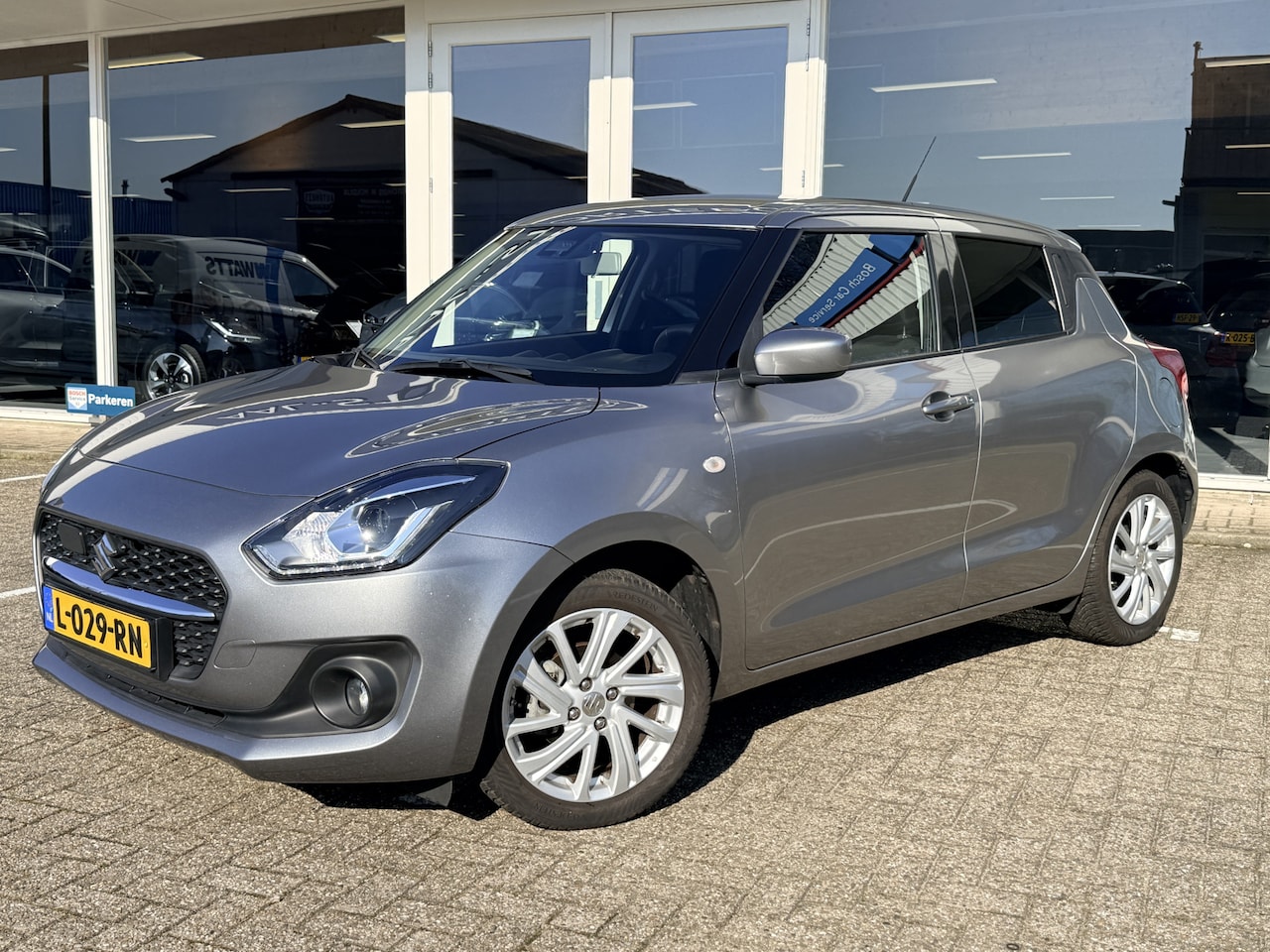 Suzuki Swift - 1.2 Comfort Smart Hybrid | Adapt. Cruise | Apple/Android | Airco | Navi | PDC | Camera - AutoWereld.nl