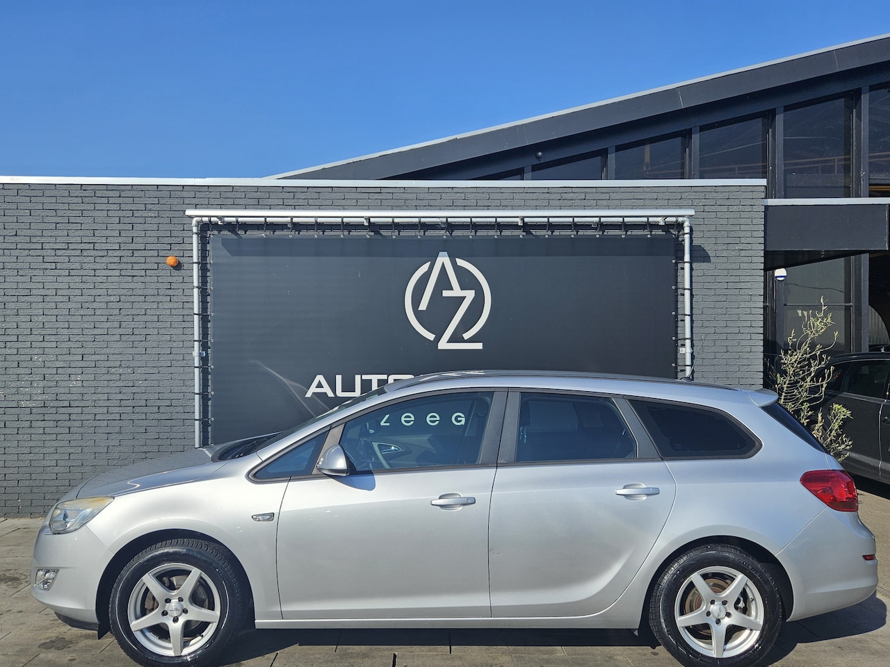 Opel Astra Sports Tourer - 1.4 Edition *AC*CC*Very Well-Kept* - AutoWereld.nl