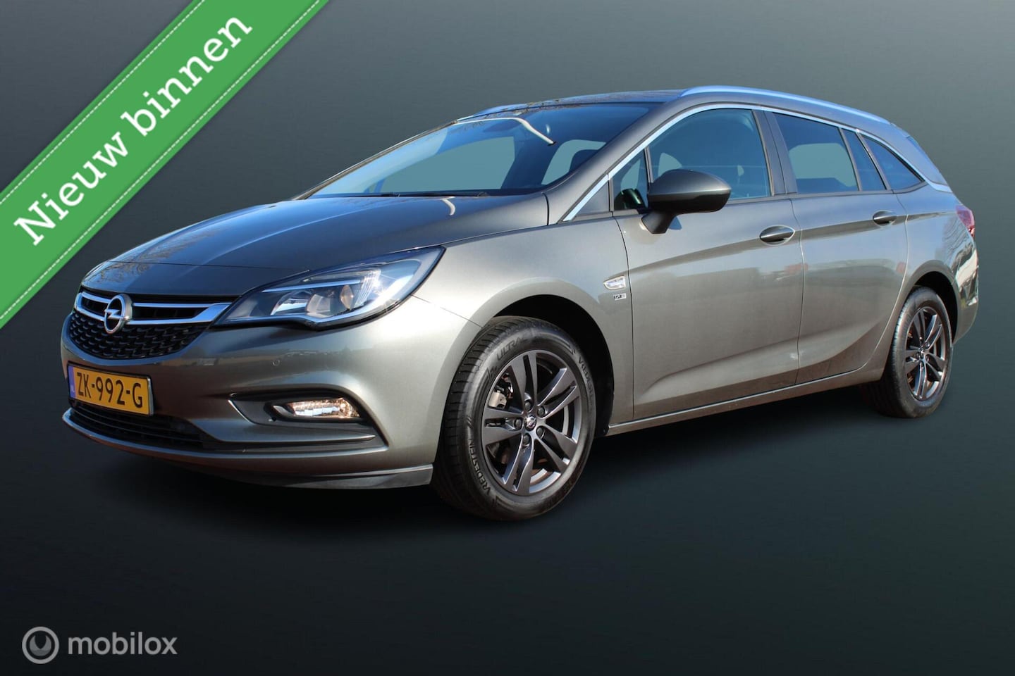 Opel Astra Sports Tourer - 1.0 Turbo 120 Jaar Edition 1.0 Turbo 120 Jaar Edition, Navigatie, Pdc voor + achter. Cruise, App connect, Donker glas - AutoWereld.nl