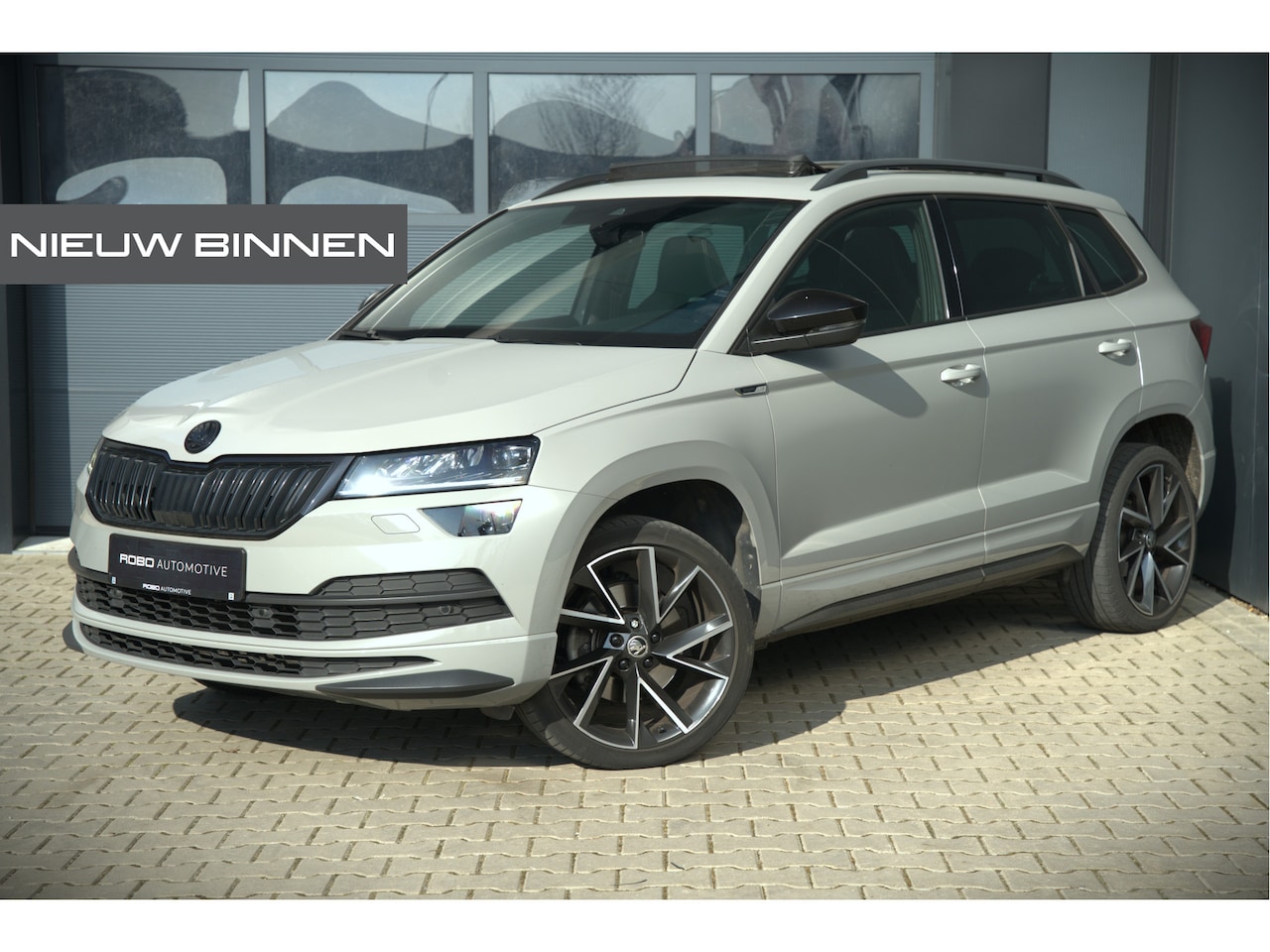 Skoda Karoq - 1.5 TSI ACT Sportline Business | Panoramadak | Stoelverwarming | Stuurverwarming | Canton - AutoWereld.nl