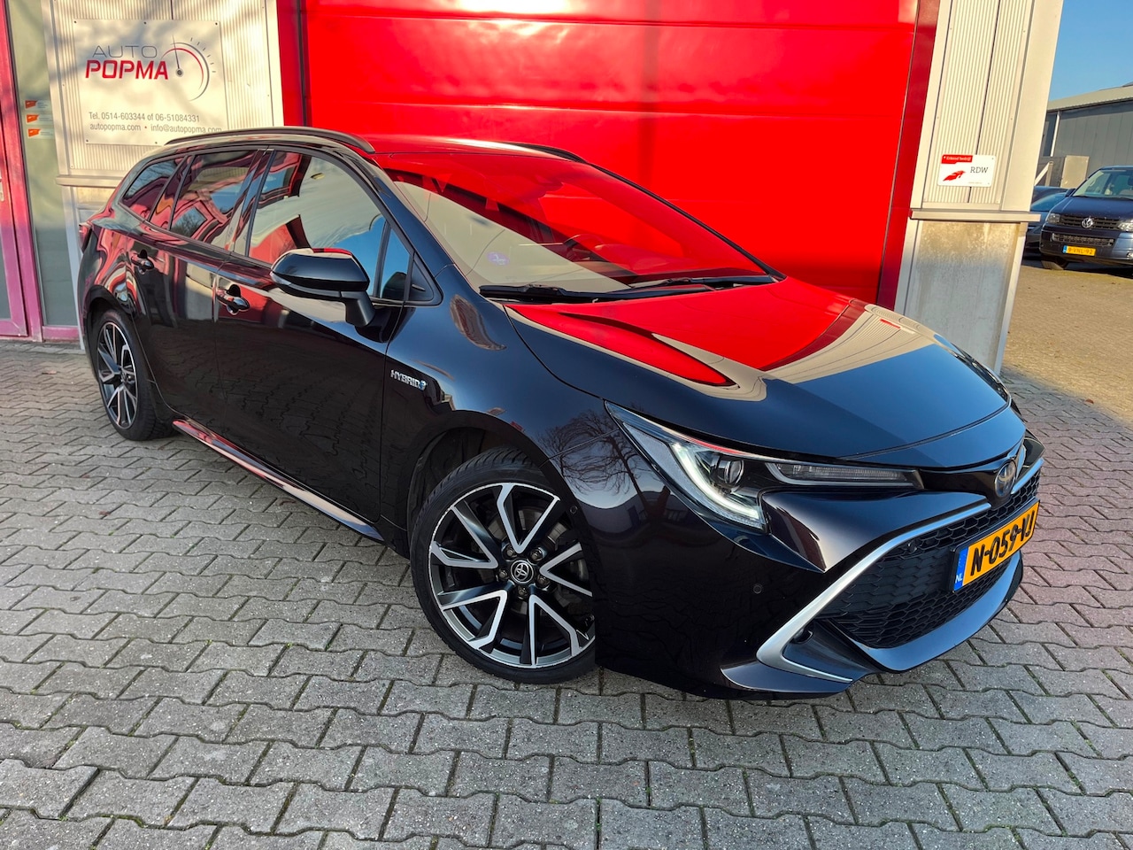 Toyota Corolla Touring Sports - 2.0 Hybrid 152pk Executive / Trekhaak / Two Tone/Sportstoelen / HUD / CarPlay / 18" / Came - AutoWereld.nl
