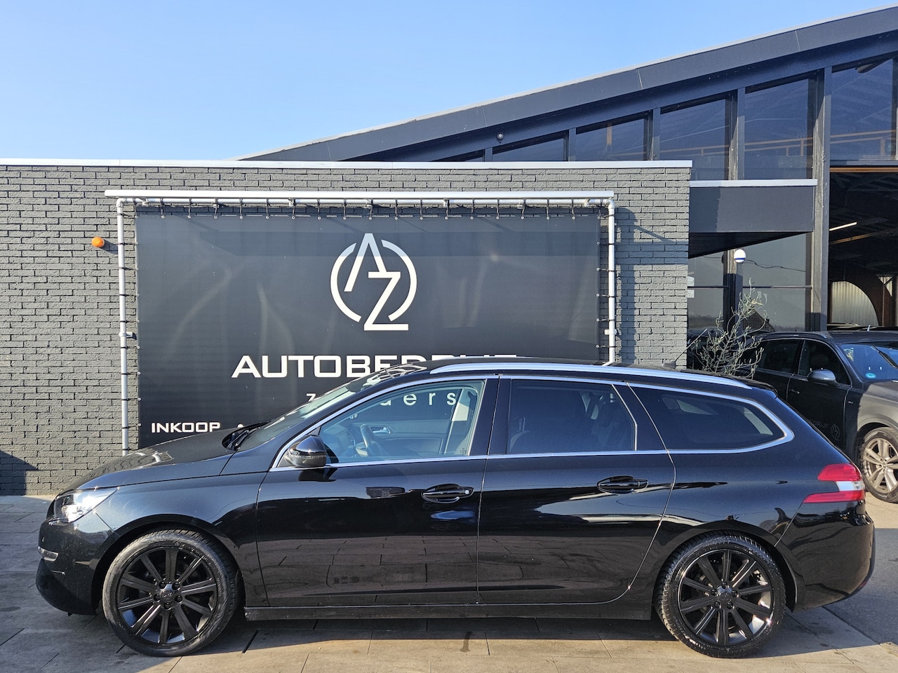 Peugeot 308 SW - 1.2 PureTech Blue Lease Executive *Noir Profond*Navi*Pano* - AutoWereld.nl