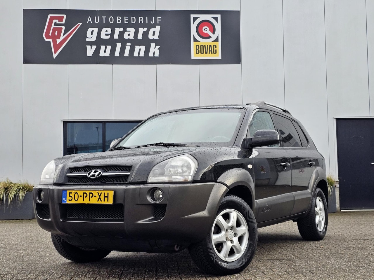Hyundai Tucson - 2.0i Dynamic CRUISE AIRCO TREKHAAK - AutoWereld.nl