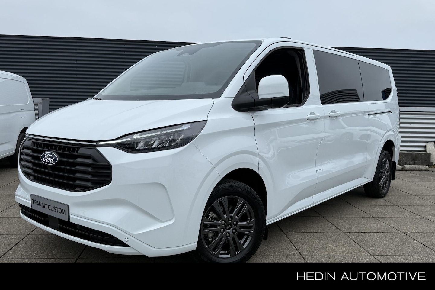 Ford Transit Custom - 340 2.5 PHEV L2H1 Limited Kombi 9-zits uit voorraad - AutoWereld.nl