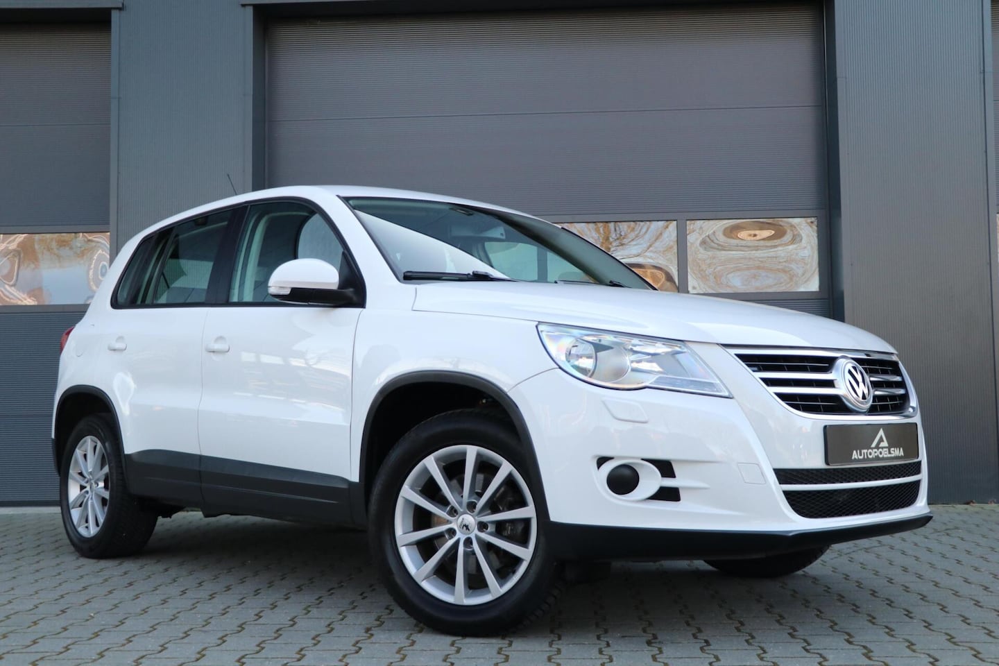 Volkswagen Tiguan - 1.4 TSI Comfort&Design Lmv Trekhaak PDC 150000KM Navigatie - AutoWereld.nl