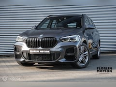 BMW X1 - xDrive25e High Executive | M-Sport | LED | HUD | Trekhaak | PHEV | Miniral Grau | Stoelver