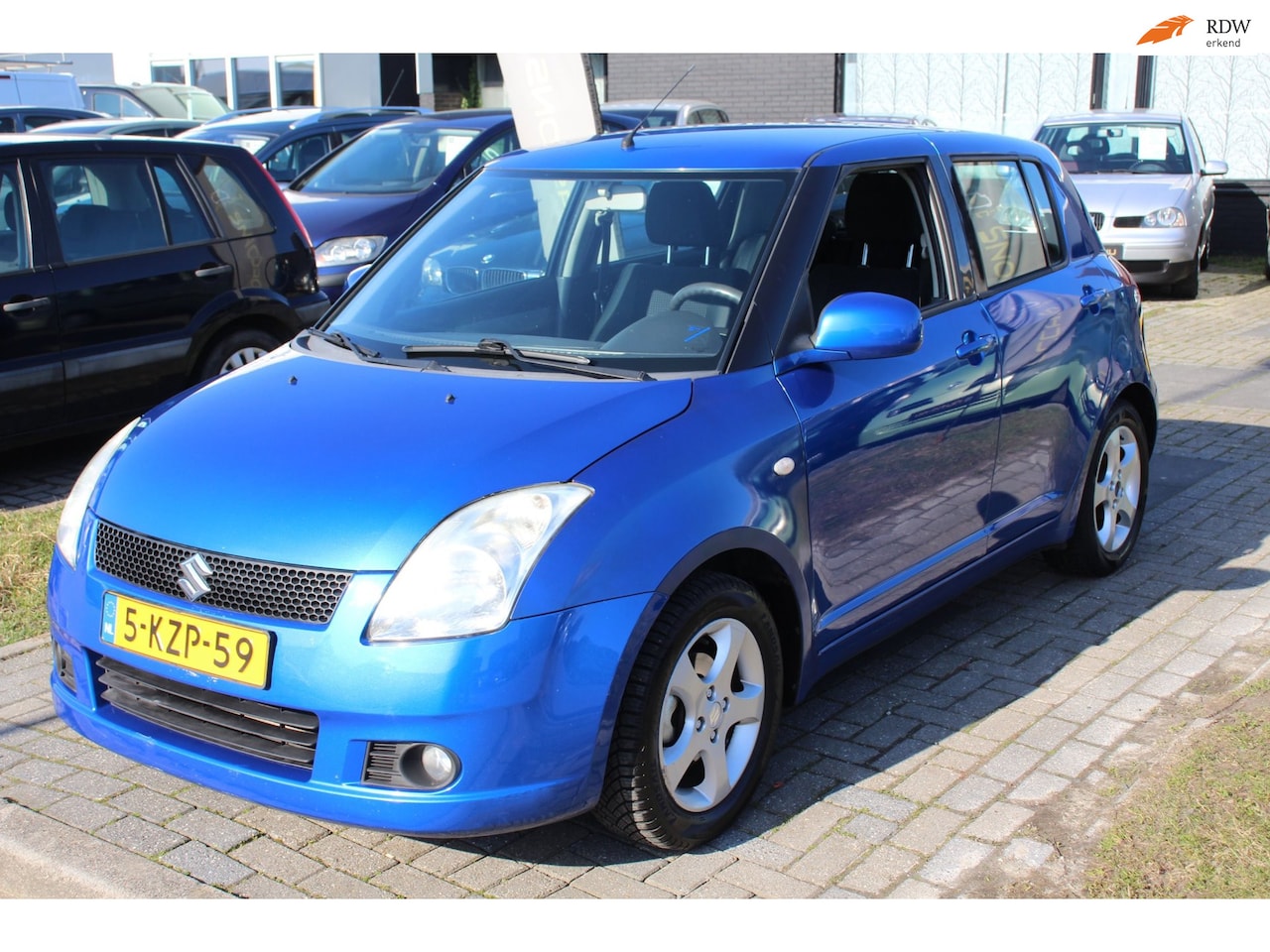 Suzuki Swift - 1.3 Shogun 5-Deurs Airco Stoelverwarming Parkeersensor LM-Velgen Elec pakket APKAPK - AutoWereld.nl