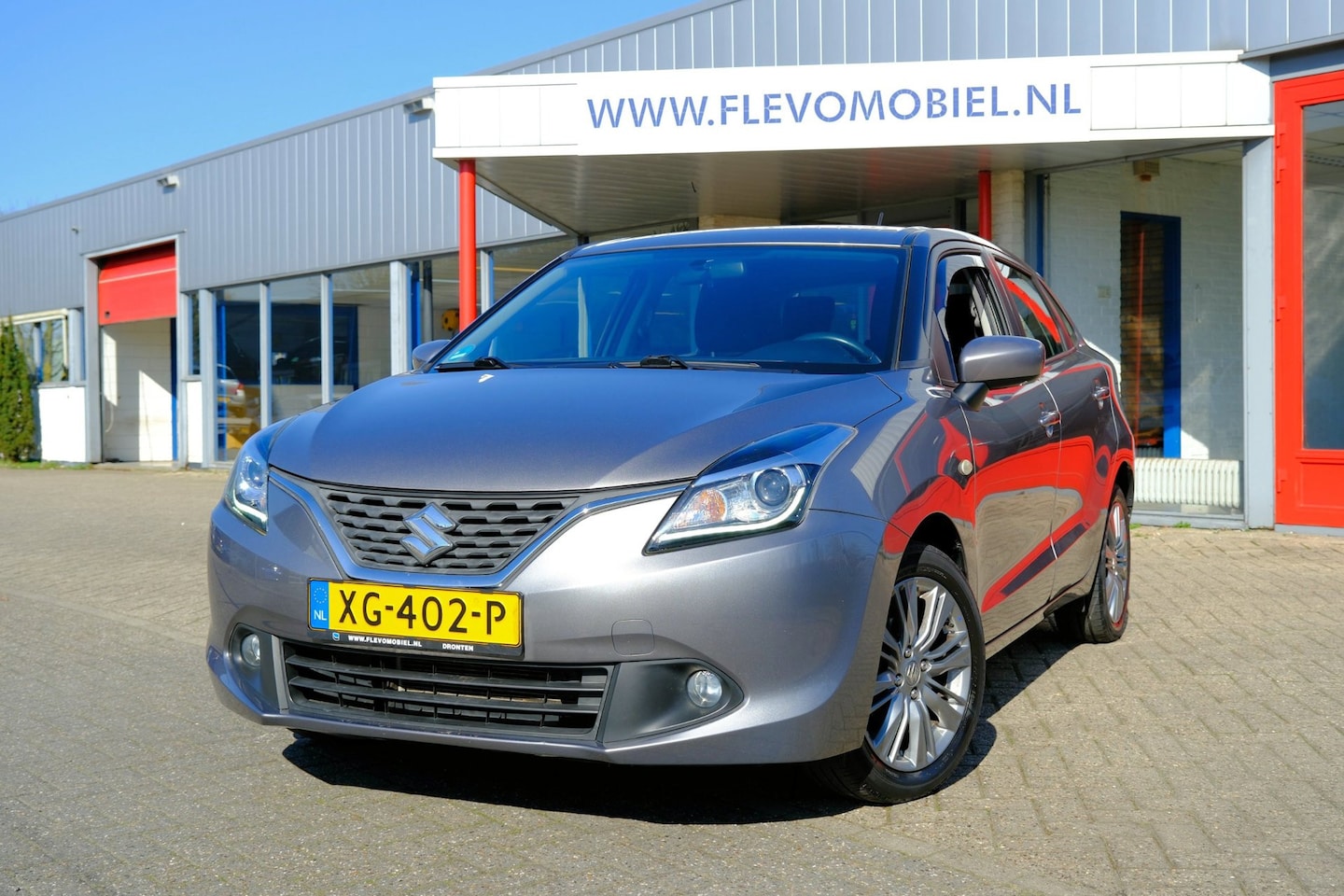 Suzuki Baleno - 1.2 Exclusive 5-drs Airco|Cruise|LMV|Trekhaak - AutoWereld.nl