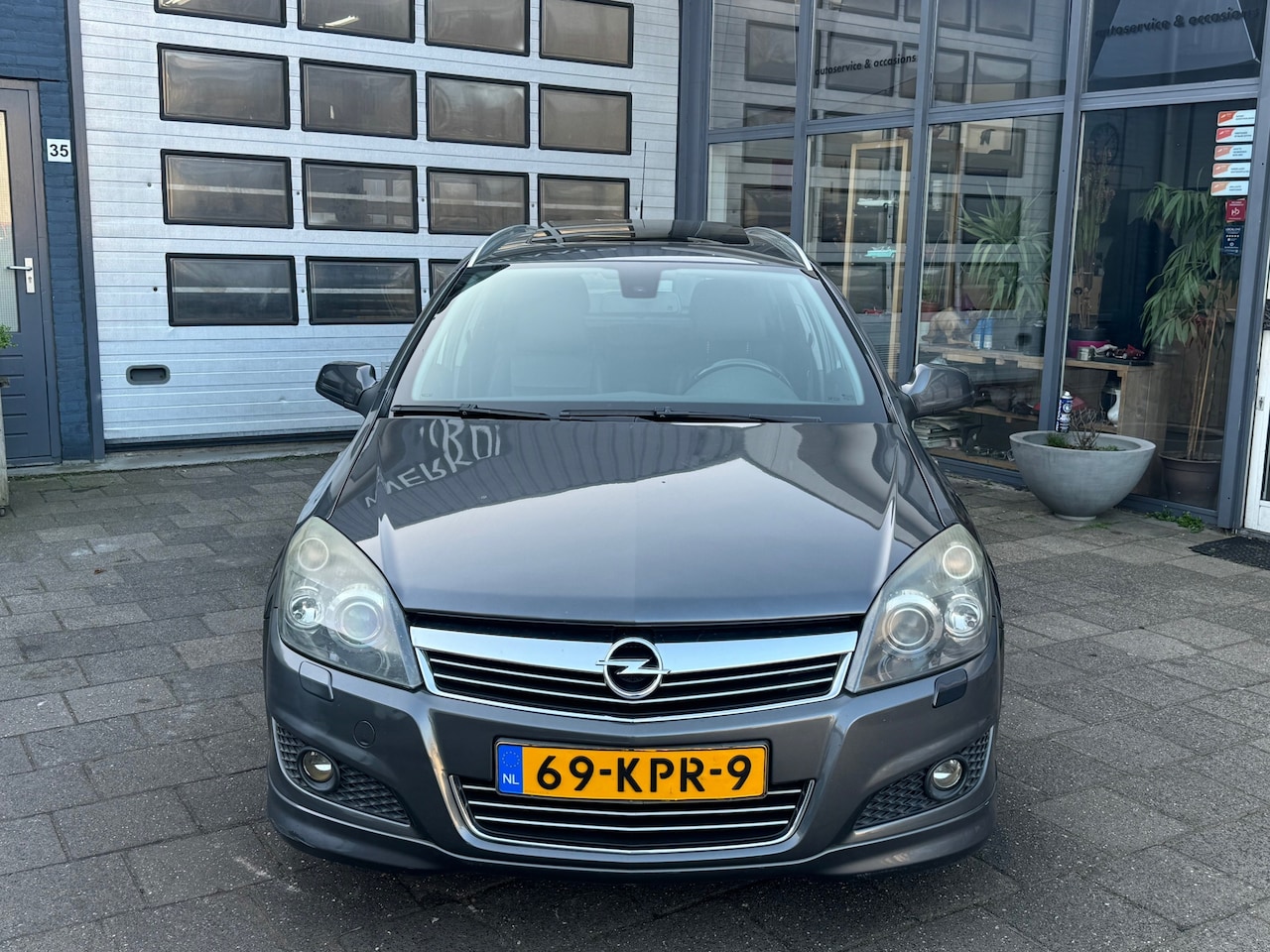 Opel Astra Wagon - 1.8 Cosmo | Clima | Navi | Pano | PDC - AutoWereld.nl
