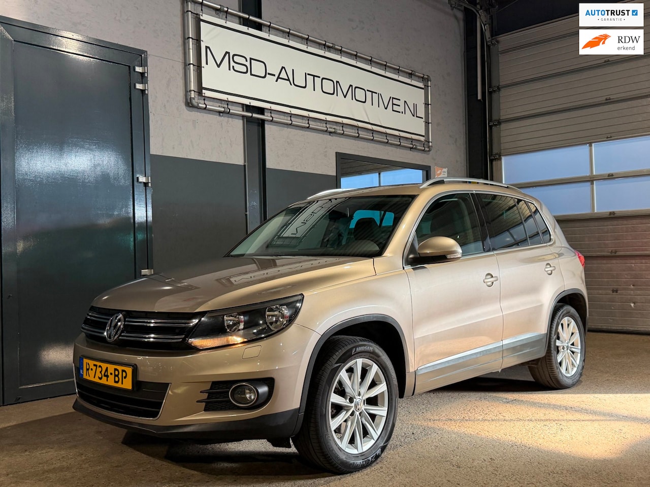 Volkswagen Tiguan - 1.4 TSI Sport&Style Stoelverwarming Panoramadak - AutoWereld.nl