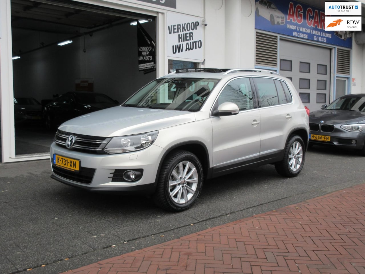 Volkswagen Tiguan - 1.4 TSI Sport & Style 4Motion Navi Pano - AutoWereld.nl