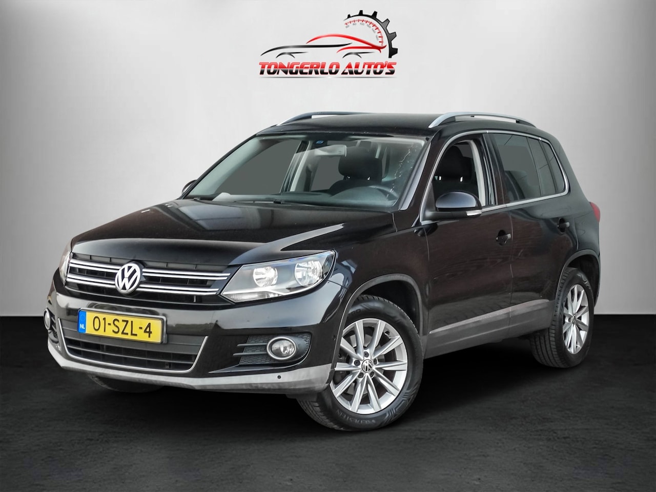 Volkswagen Tiguan - 1.4 TSI Sport&Style 4Motion Pdc Camera Cruise Navi 17'' LM - AutoWereld.nl