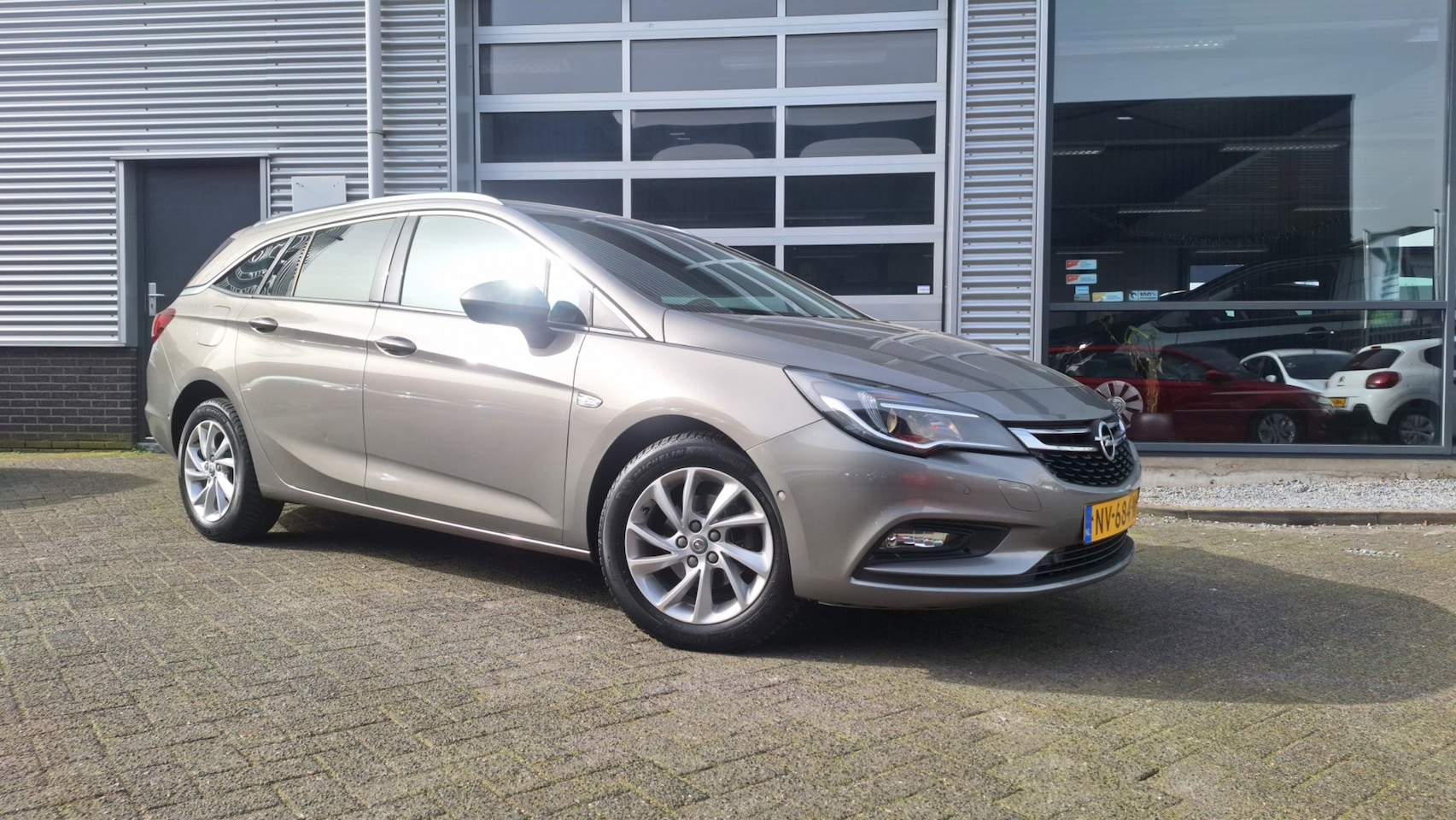 Opel Astra Sports Tourer - 1.4 Turbo 150Pk Innovation/Navigatie/ Lm Pdc Trekhaak/Enz Top staat!! - AutoWereld.nl