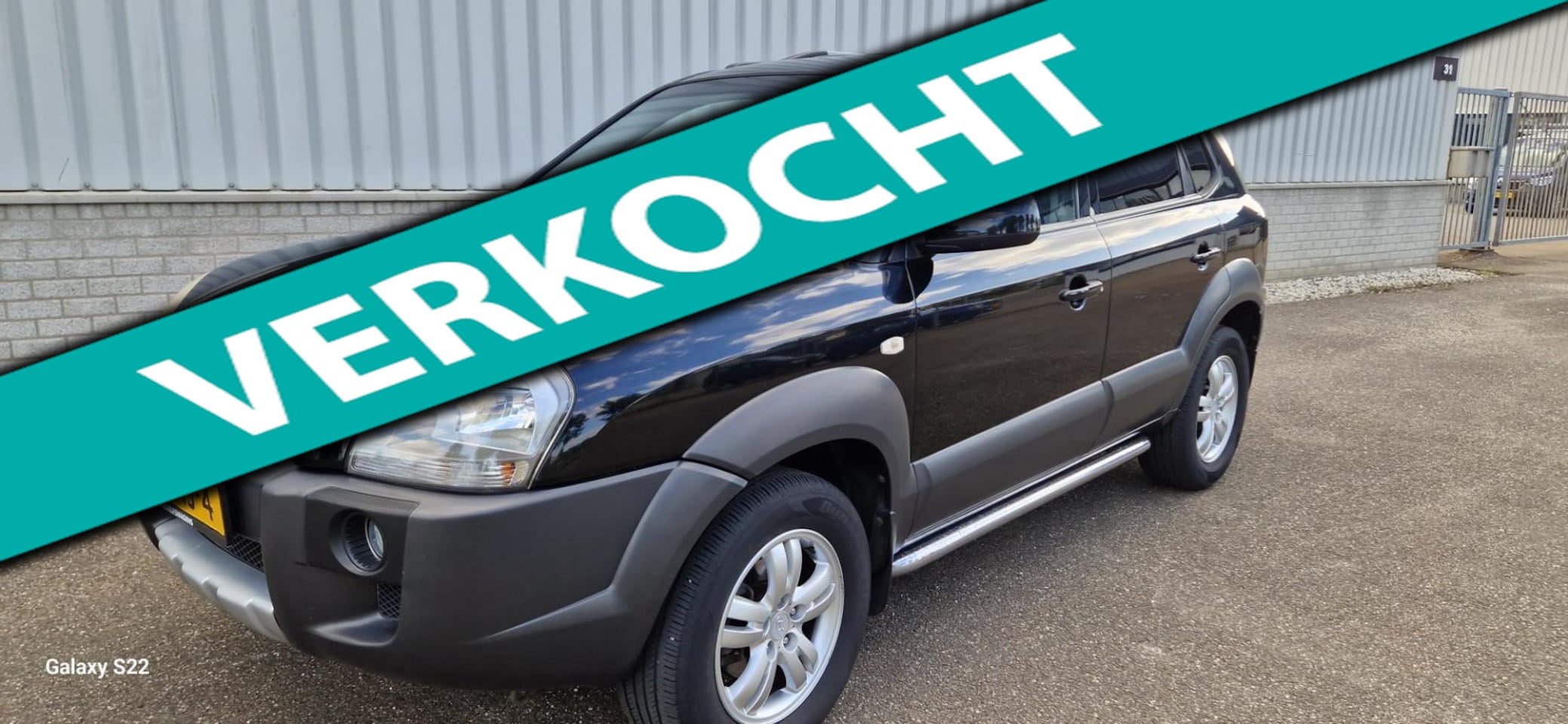 Hyundai Tucson - 2.0i Style Cross 2.0i Style Cross - AutoWereld.nl