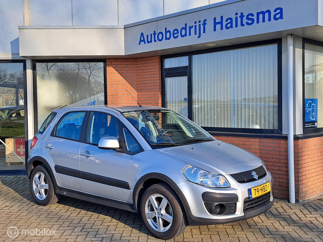 Suzuki SX4 - 1.6 Comfort Out Door Airco | LMV | Tr.Hk - AutoWereld.nl
