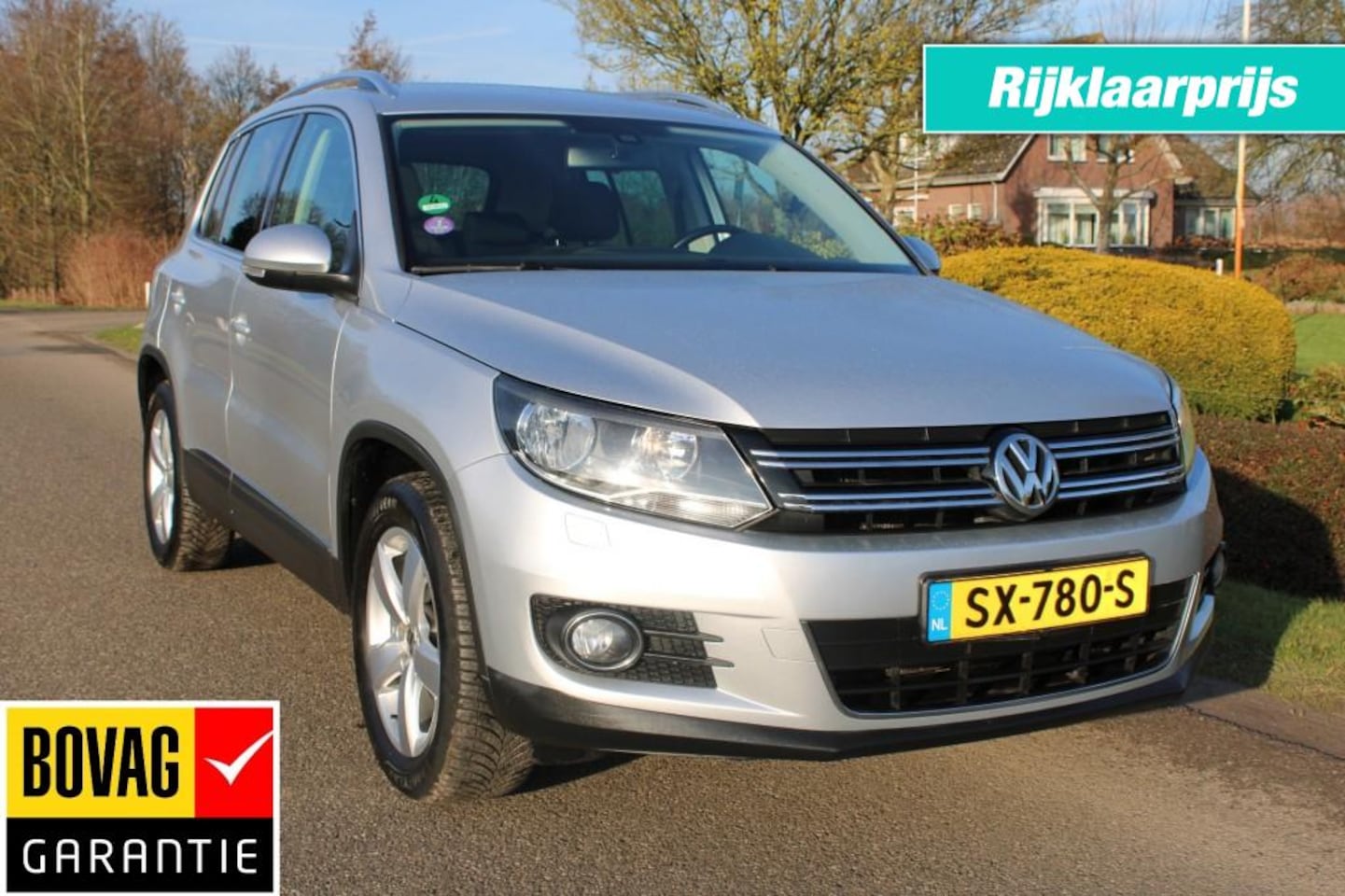 Volkswagen Tiguan - 1.4TSI 122pk SportenStyle ECC/cruise/navi/PDC/trekhaak - AutoWereld.nl