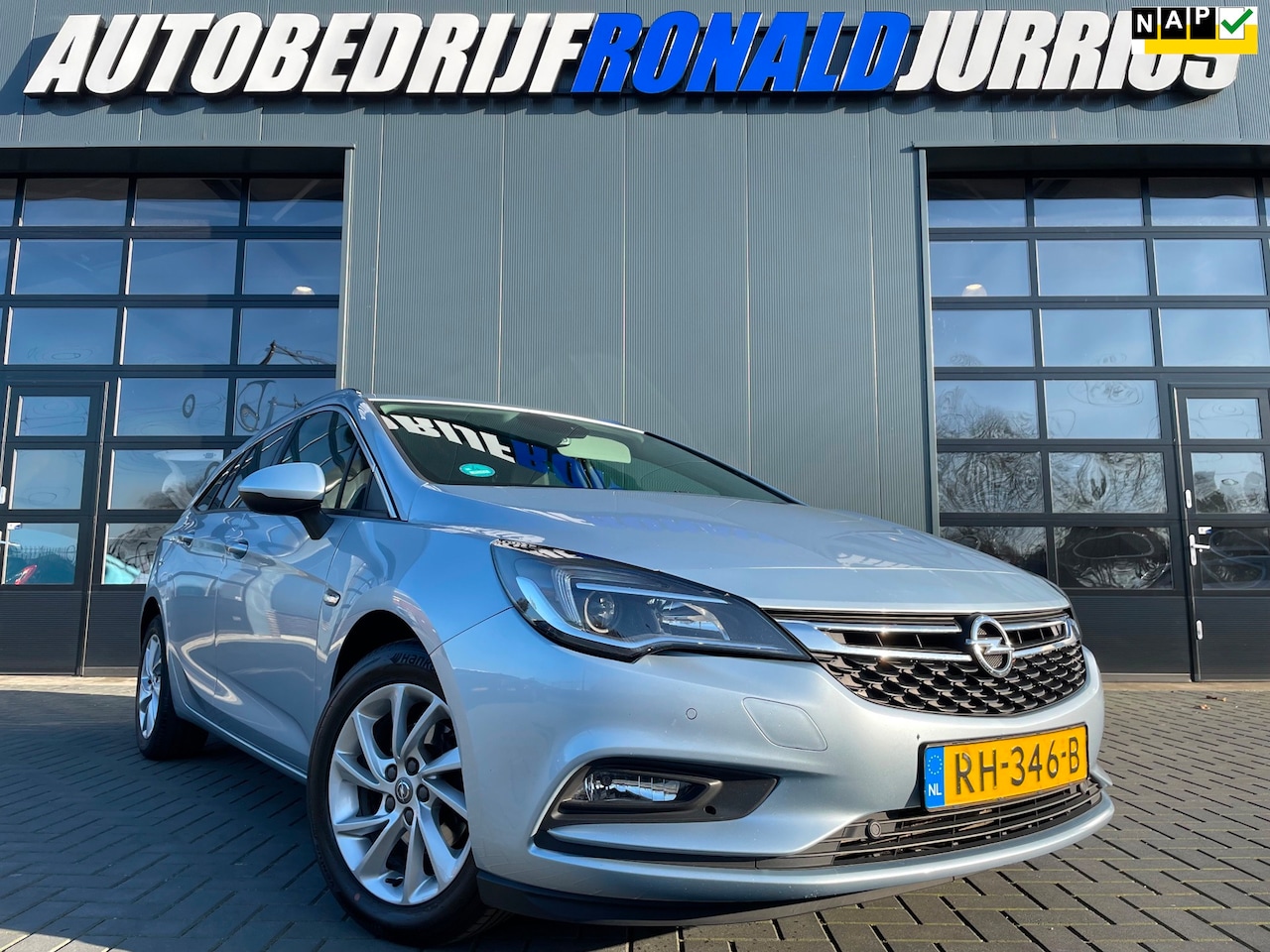 Opel Astra Sports Tourer - 1.0 Turbo Business Executive NL.Auto/Airco/Cruise/Elc.kofferklep/Navigatie/Goed onderhoude - AutoWereld.nl