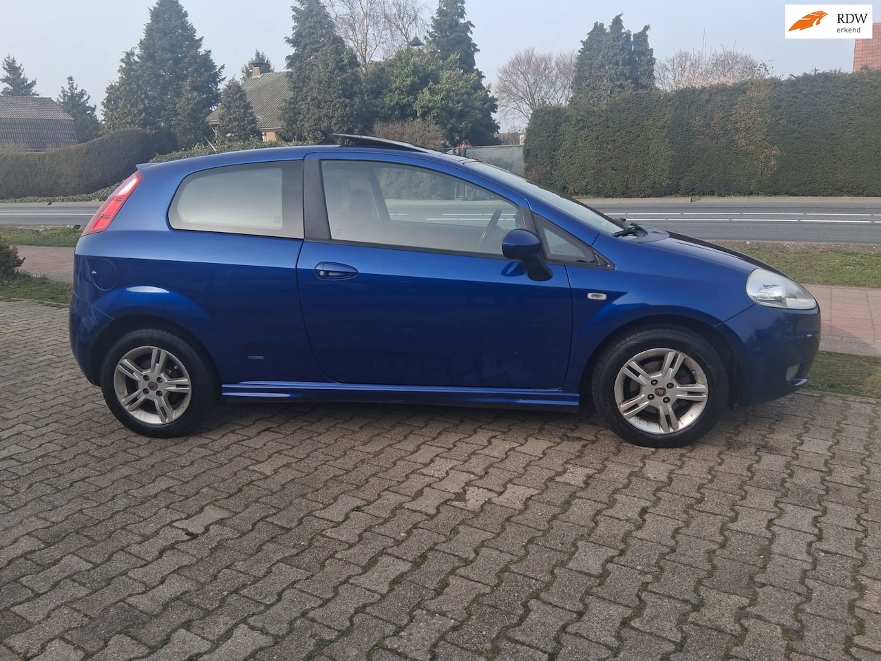 Fiat Grande Punto - 1.4 GP met airco en glaskantelschuifdak - AutoWereld.nl