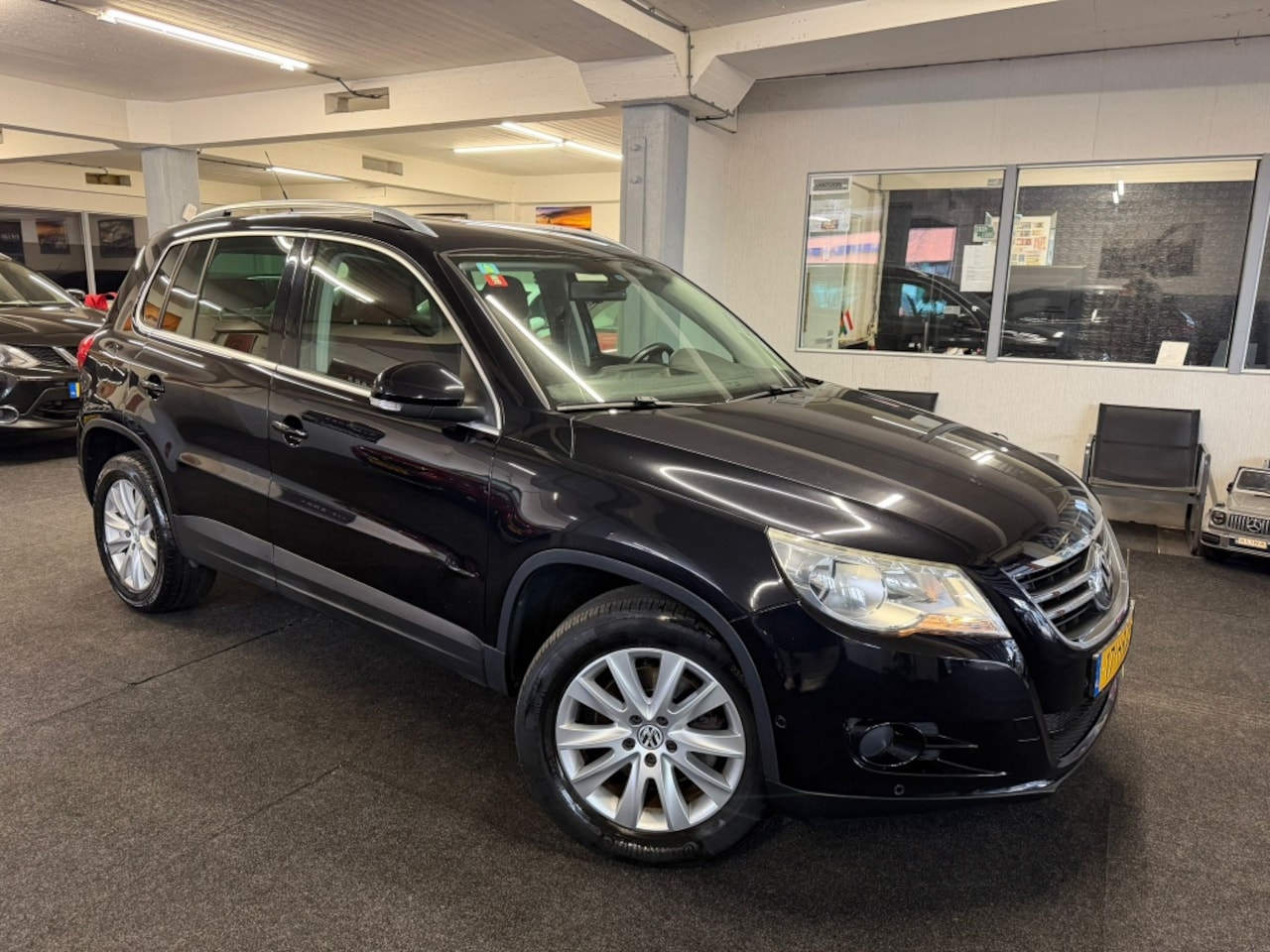 Volkswagen Tiguan - 2.0 TSI Sport&St.4M*NAP*Leder*Stoelver.*Velgen - AutoWereld.nl