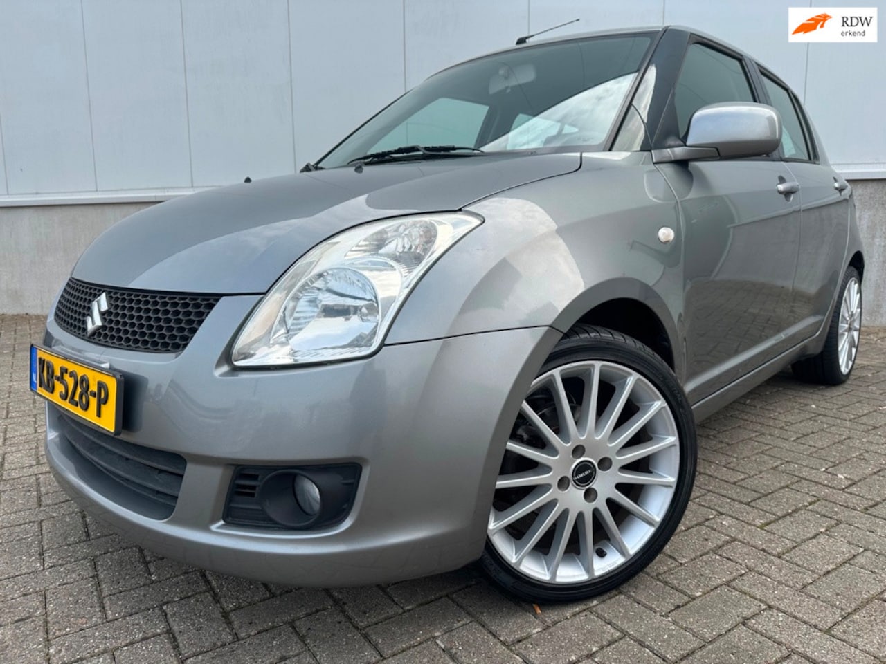 Suzuki Swift - 1.3 Exclusive 1e eigenaar Airco Stoelverwarming - AutoWereld.nl