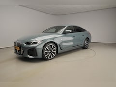 BMW i4 - Gran Coupé eDrive40 | M-Sportpakket | LED | Navigatie | Stoelverwarming | Keyles go | DAB