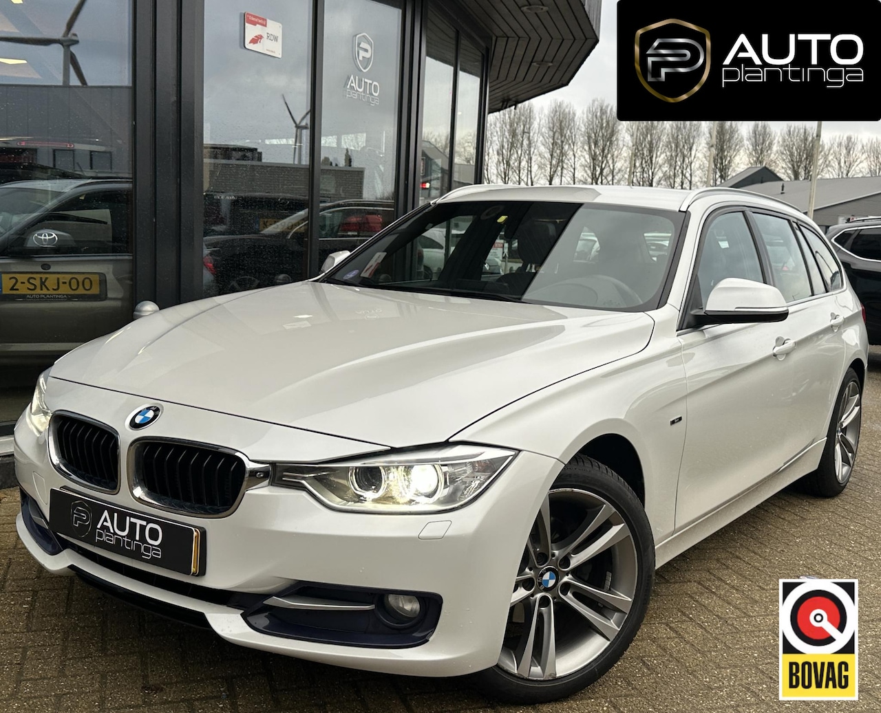 BMW 3-serie Touring - 316i High Executive | AUTOMAAT | NL AUTO | Sport-Line | Leer | Stoelverwarming | Navigatie - AutoWereld.nl