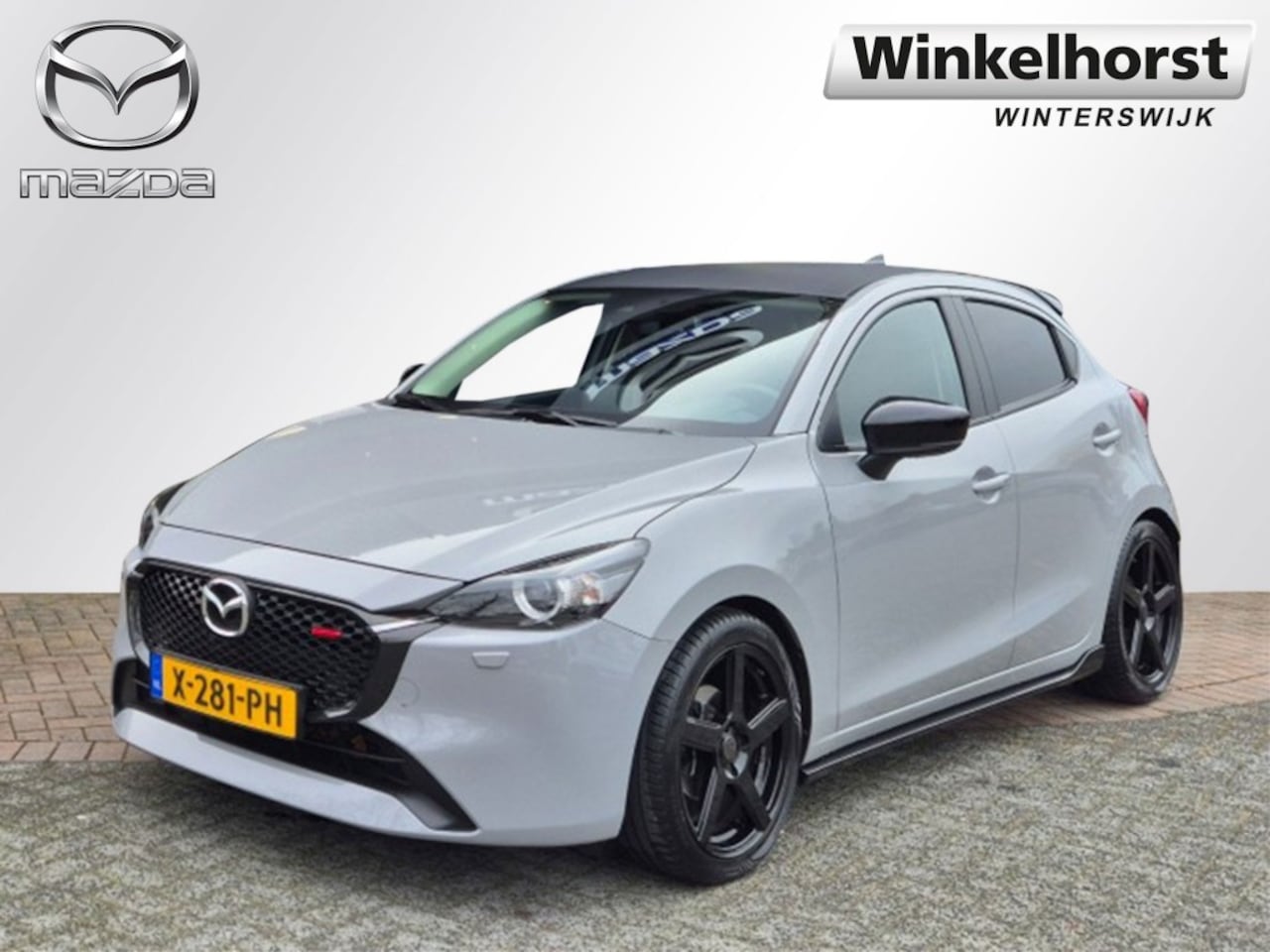 Mazda 2 Hybrid - E- SKYACTIV- G 90 6MT M-HYBRID HOMURA Aka / Aero-Pakket - AutoWereld.nl