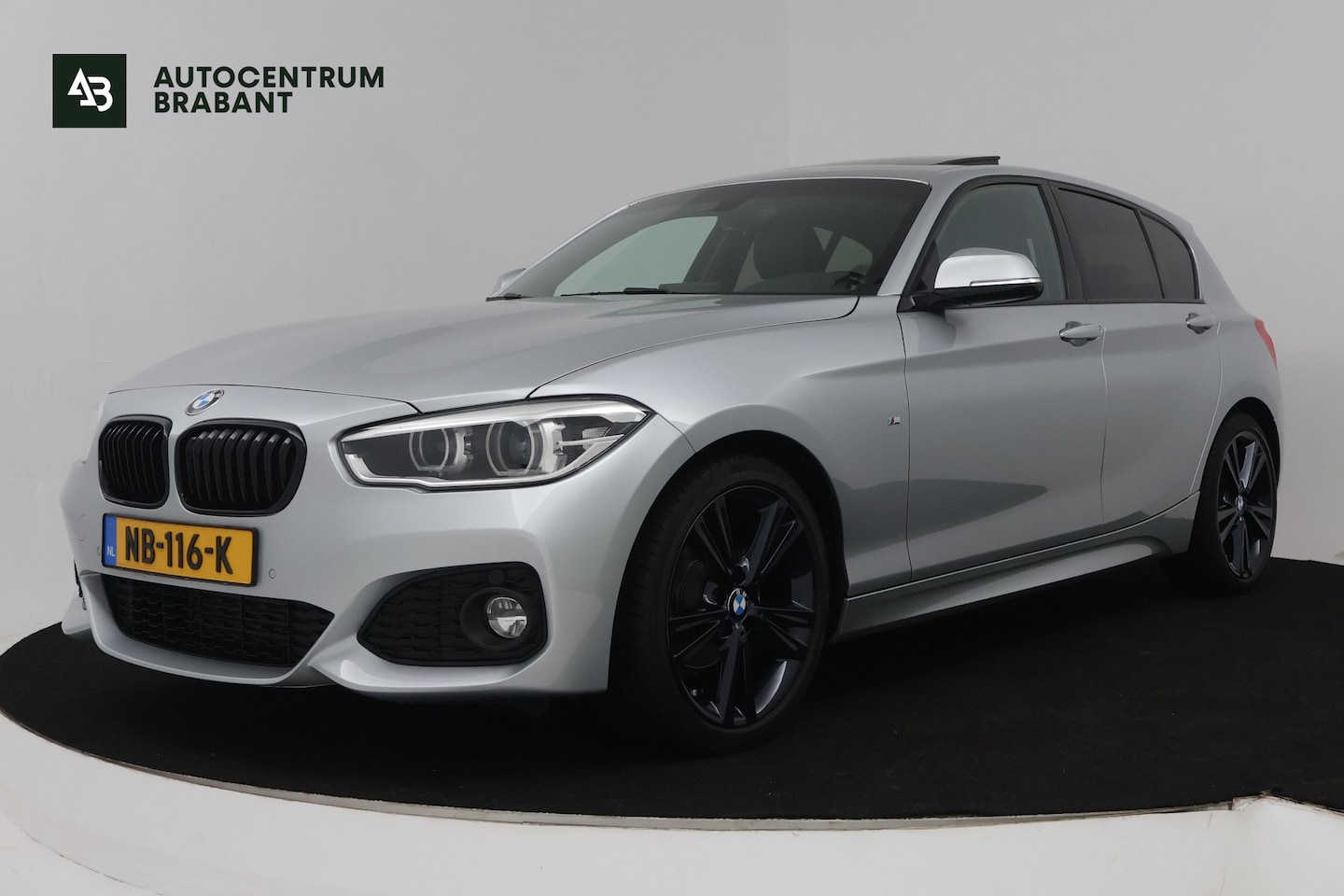 BMW 1-serie - 118i Centennial High Executive (PANORAMADAK, STOELVERWARMING, CRUISE CONTROL, NAVIGATIE, D - AutoWereld.nl