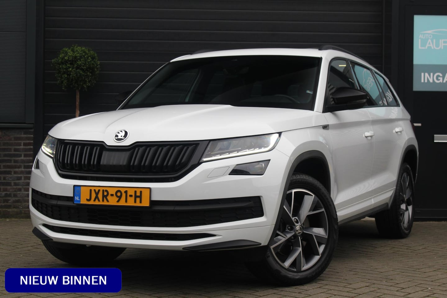 Skoda Kodiaq - 2.0 TSI 4x4 Sportline Business | Panoramadak | Trekhaak | stuur en stoelverwarming | Bomvo - AutoWereld.nl