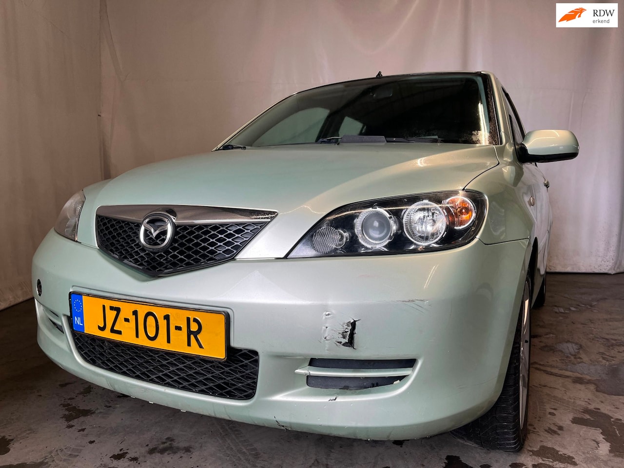 Mazda 2 - 1.4 Exclusive - Schade - AutoWereld.nl