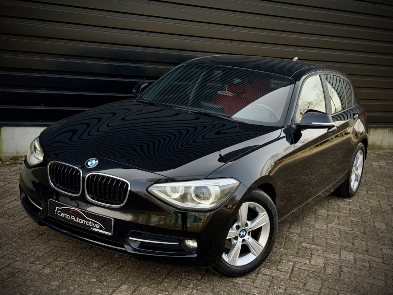 BMW 1-serie - 116i Exec SPORTLEER|XENON|NAVIPRO|STOELVERW - AutoWereld.nl