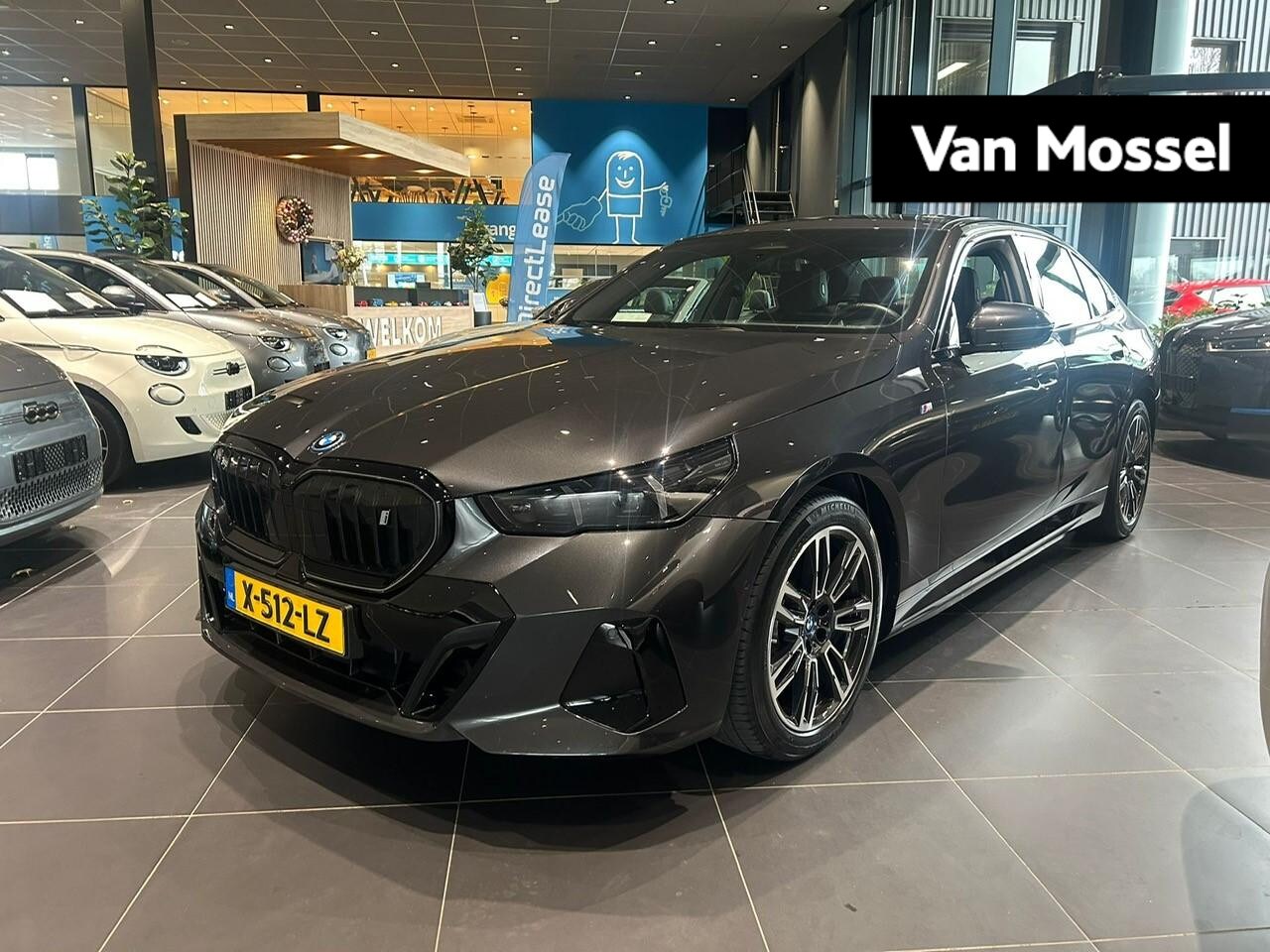 BMW i5 - eDrive40 84 kWh AUTOMAAT | M-PAKKET | NAPPA LEDER | WARMTEPOMP | SFEERVERLICHTING | HARMAN - AutoWereld.nl