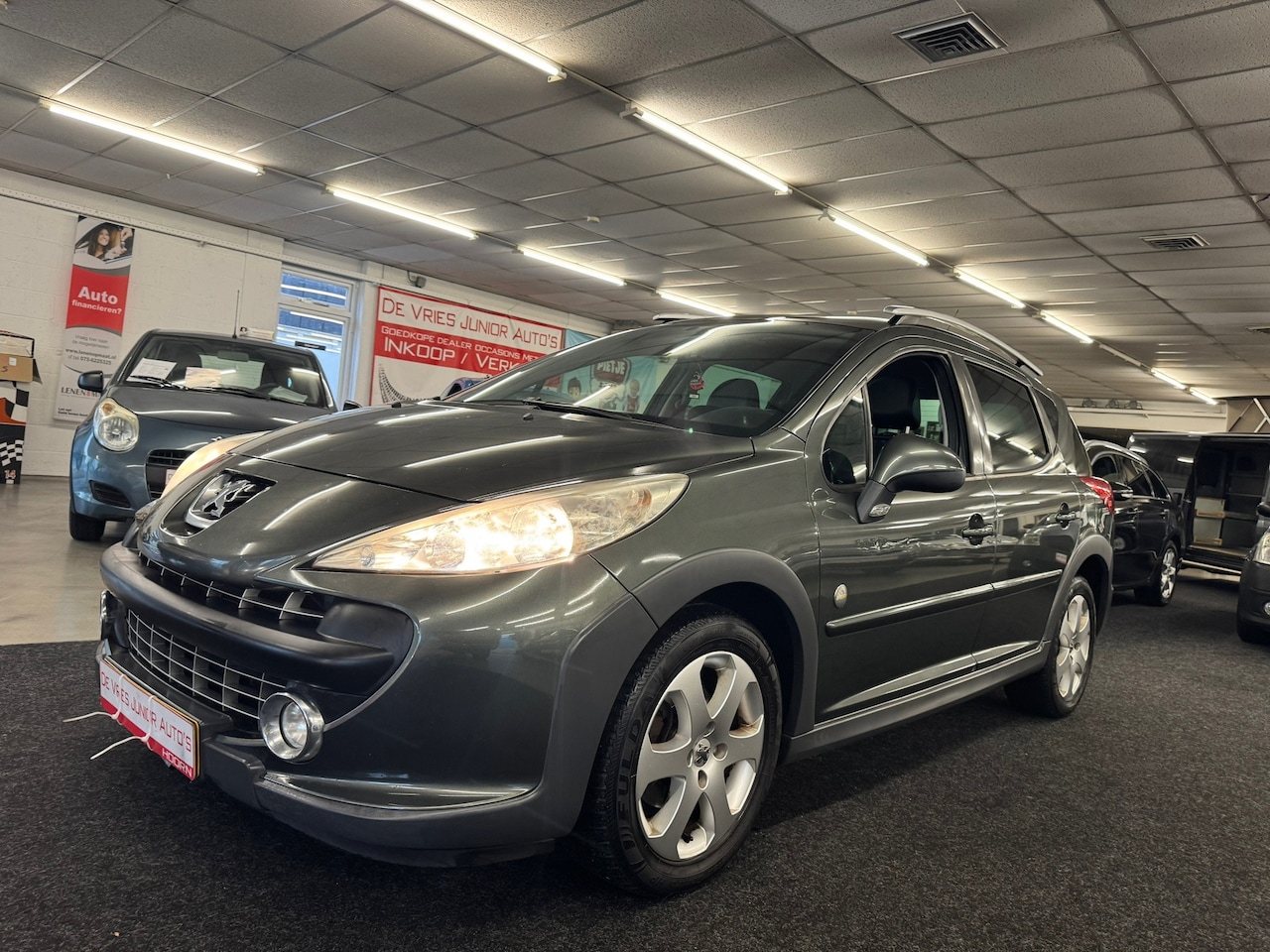 Peugeot 207 SW Outdoor - 1.6 VTi Sublime. Cruise control, lederen/stof bekl., trekhaak, panodak en meer! - AutoWereld.nl