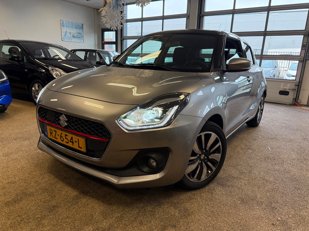 Suzuki Swift - 1.0 Stijl Smart Hybrid | Navi | Carplay | tot 10 jaar Garantie! - AutoWereld.nl