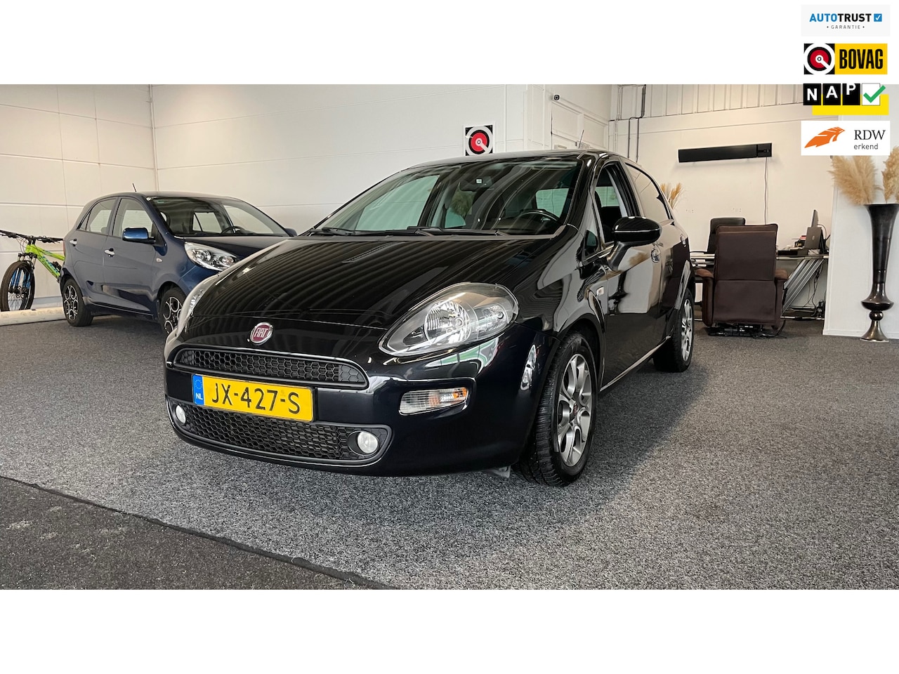 Fiat Punto Evo - 0.9 TwinAir Lounge 0.9 TwinAir Lounge, Cruise control, Airco, Bluetooth - AutoWereld.nl