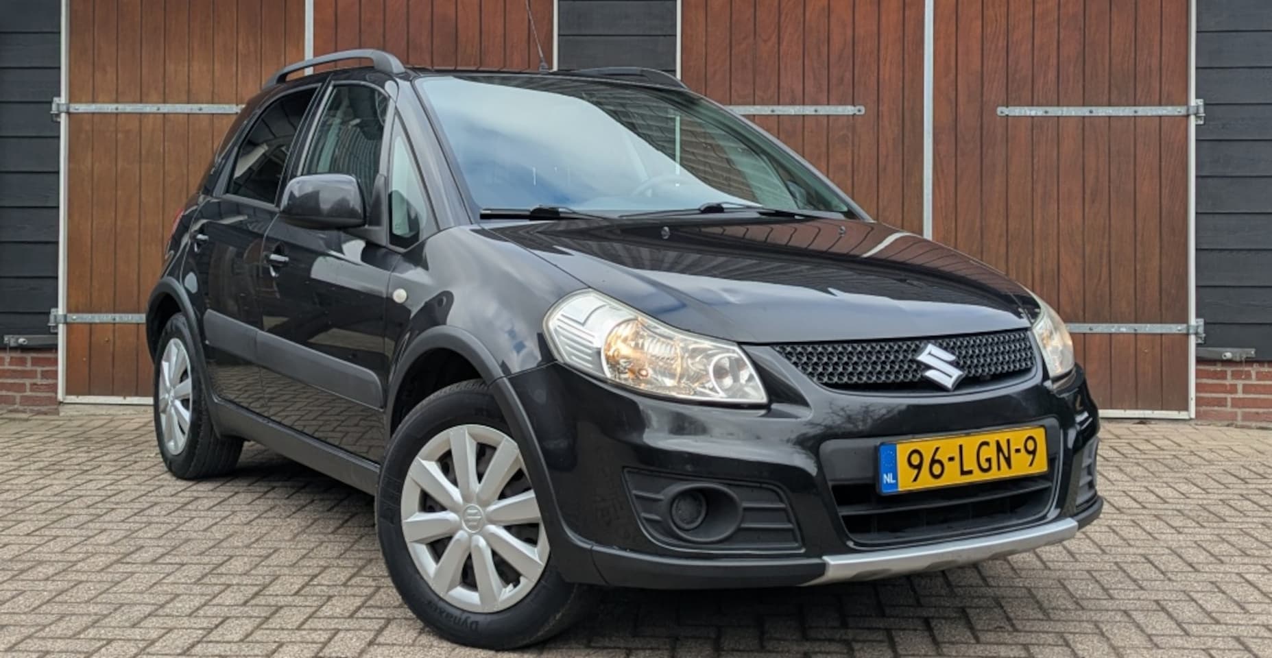Suzuki SX4 - 1.6 Comfort 1.6 Comfort, Airco, Trekhaak, NAP, Hoge instap - AutoWereld.nl